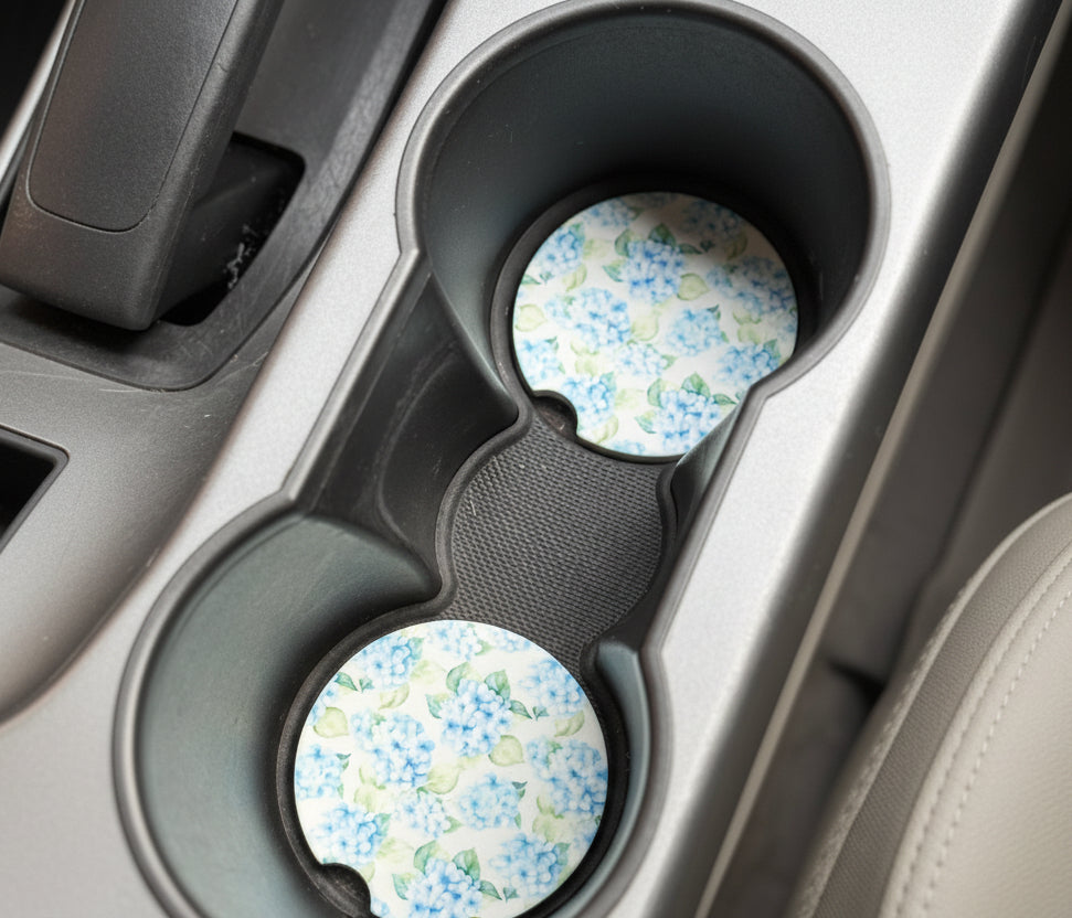Floral-patterned cup holders in a car's cup holder tray