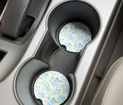 Floral-patterned cup holders in a car's cup holder tray