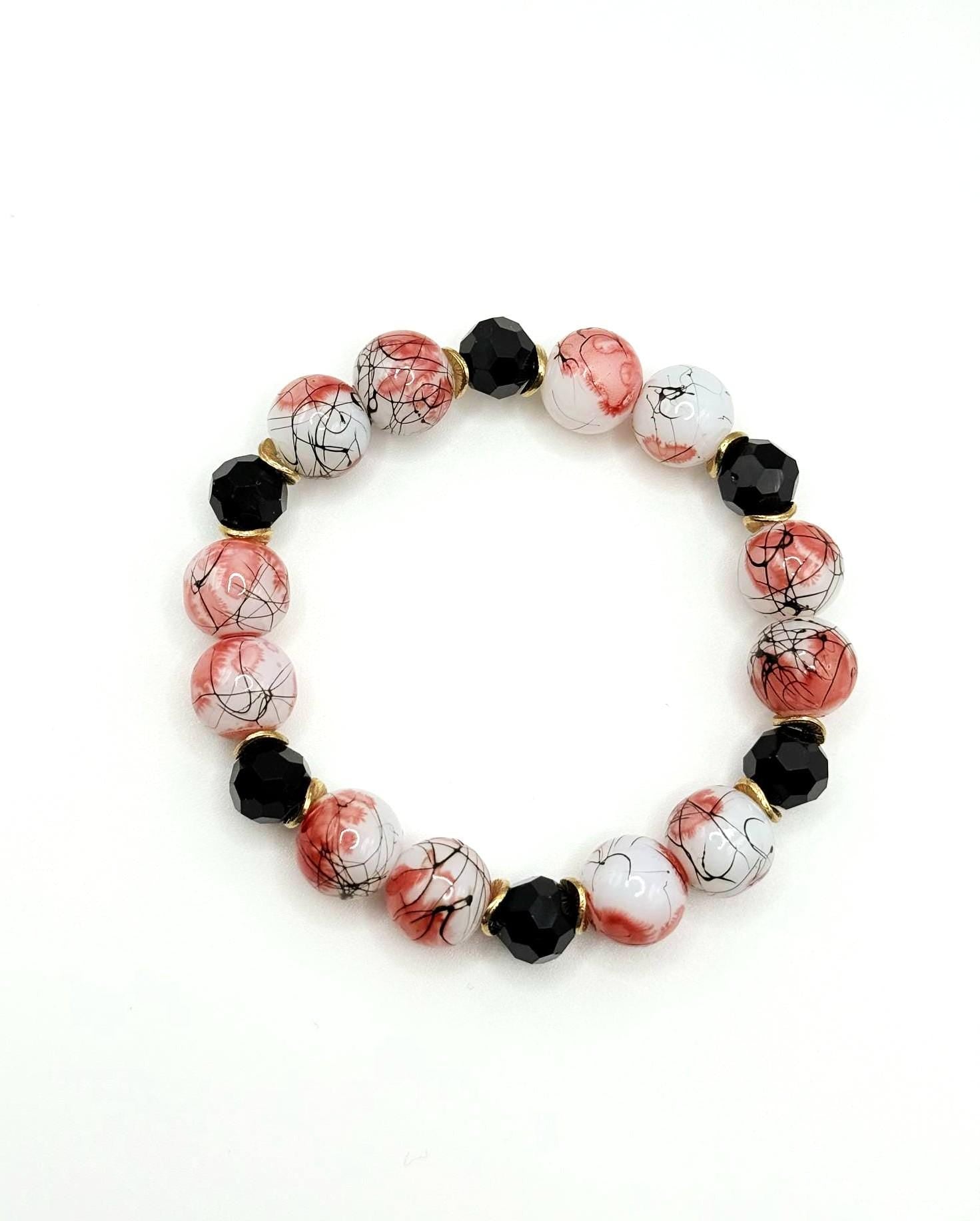 Red and Black Paint Splatter Glass Bead and Gold AccentBracelet